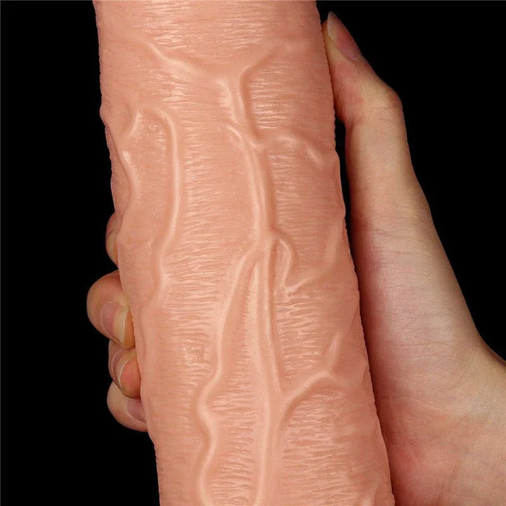 Close-up of the King Size 11 inch dildo beside fingers, detailing the sculpted veins