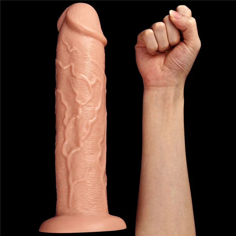 King Size 11 inch dildo standing next to a clenched fist for a size comparison