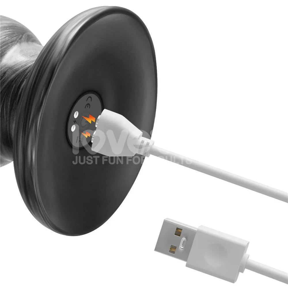 Magnetic USB charger held to the base contacts of the grey Vibrax Slider 12.5 inch