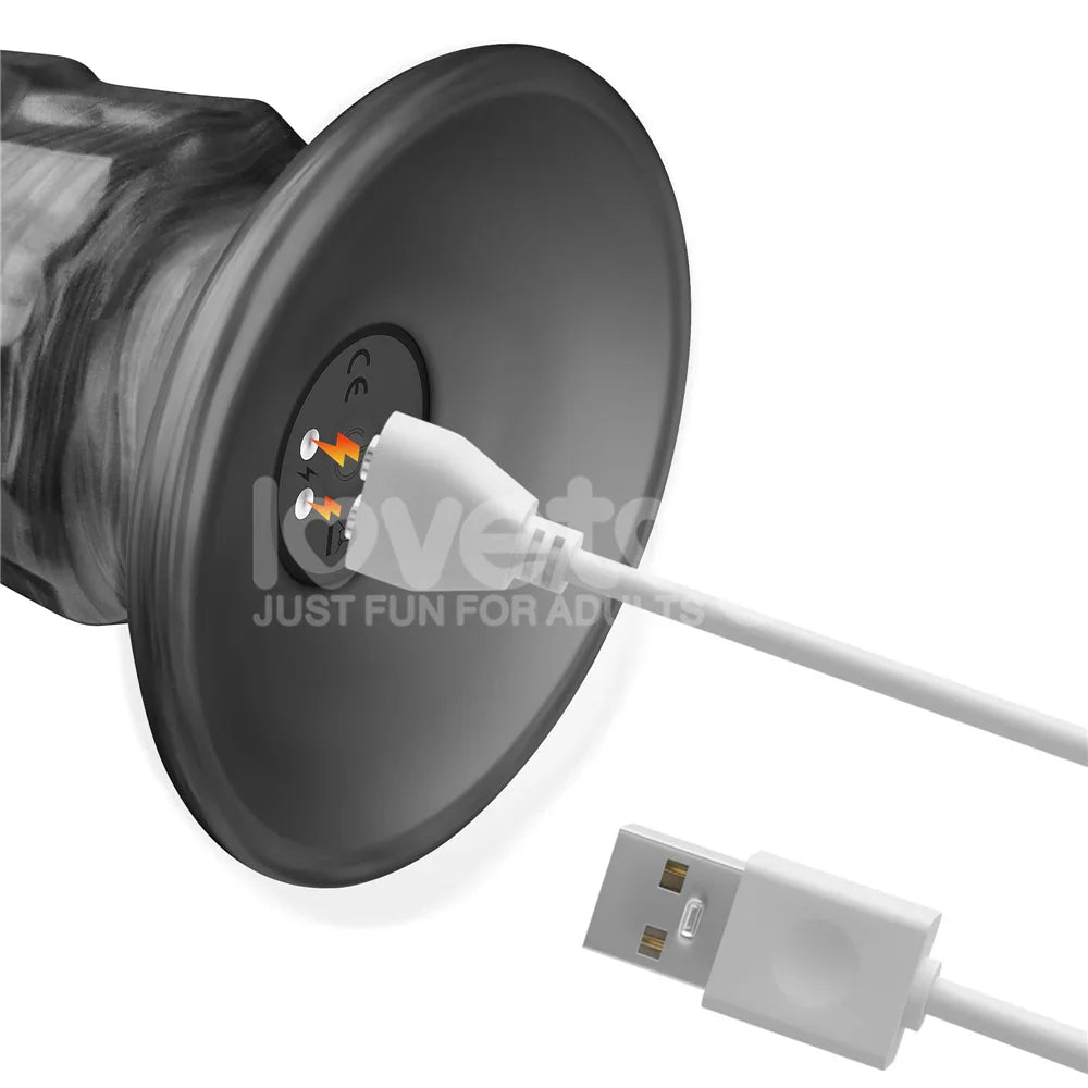 Magnetic USB charging cable meeting the base contacts of the Vibrax Slider 14.5 inch