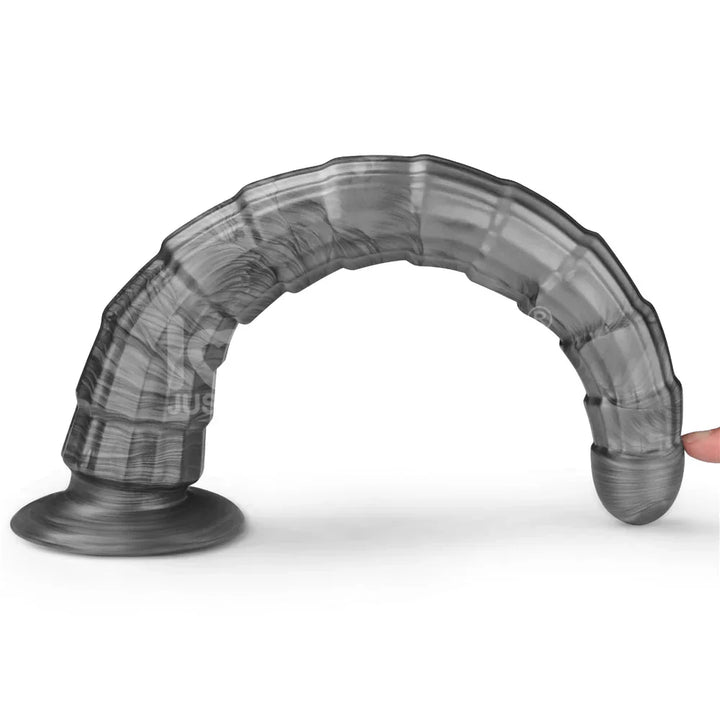 Vibrax Slider 14.5 inch bent into an arch by a fingertip, showing its flexibility