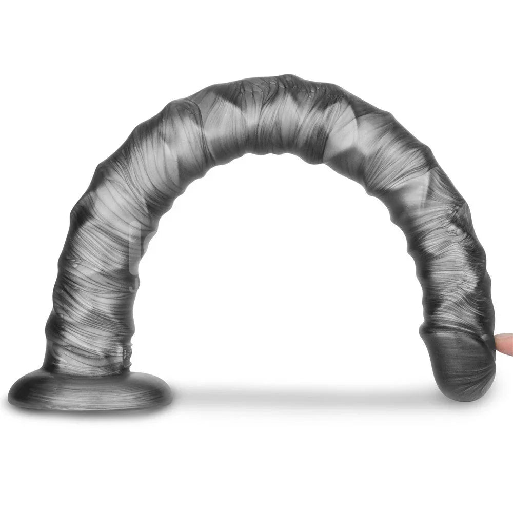 Vibrax Slider 16 inch bent into a full arch by a fingertip, showing extreme flexibility