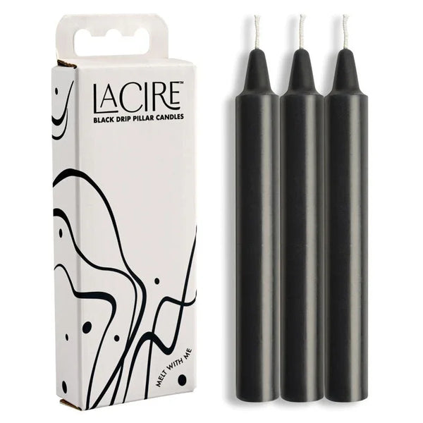 LaCire Black Drip Pillar Candles: white carton beside the three black candles