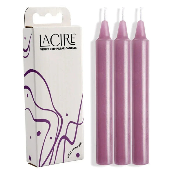 LaCire Violet Drip Pillar Candles: white carton beside the three violet candles