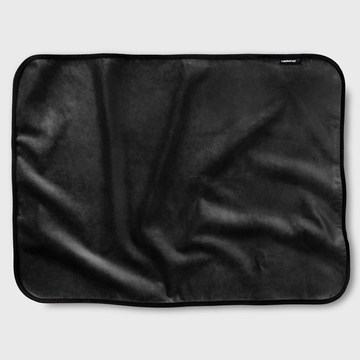 Liberator Fascinator Throw Mini in black, laid flat from above