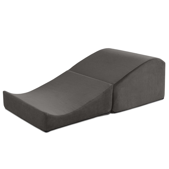 Liberator Flip Ramp in black opened out into a curved ramp, on white