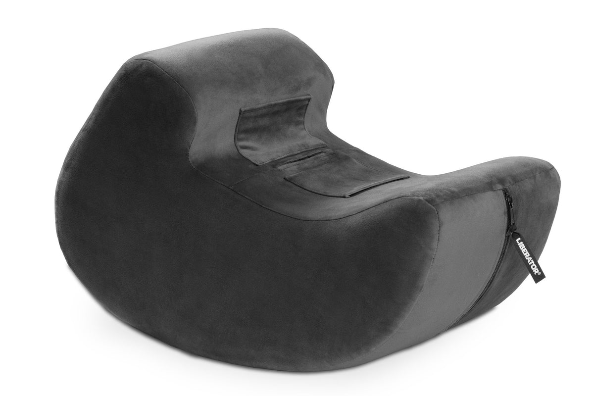 Liberator Pulse rocking cushion in black with its toy pocket, on white