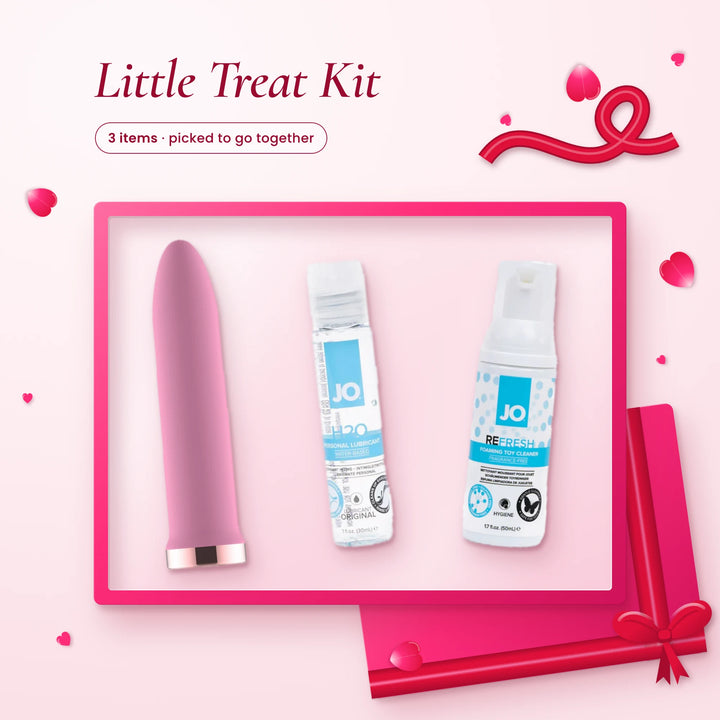 Little Treat Kit: a pink rechargeable bullet vibrator, JO H2O lube and JO foaming toy cleaner on a pink backdrop