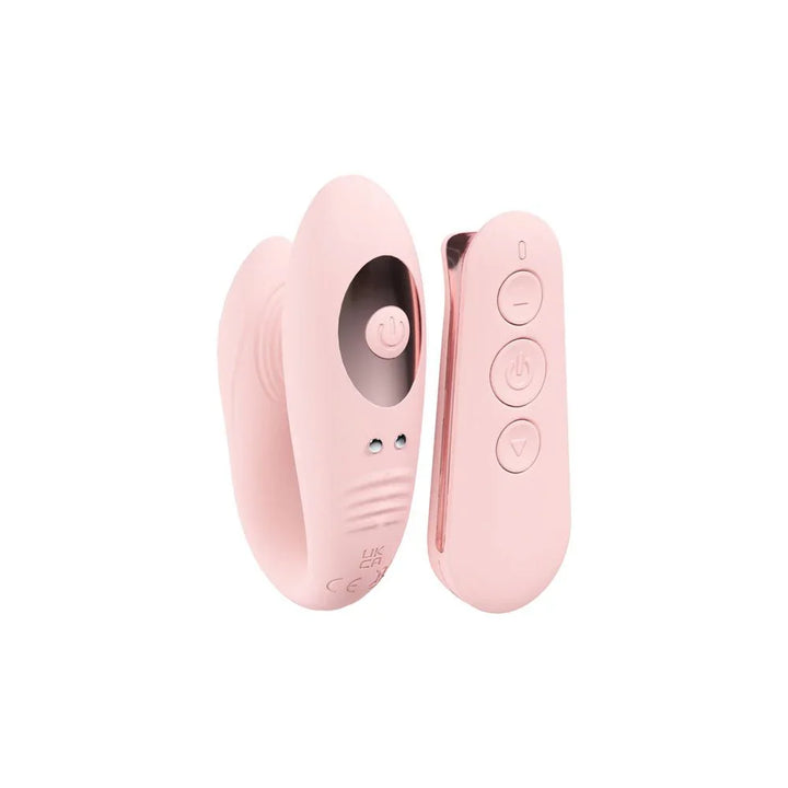 Loveline Charme Dual Motor Vibrator in Pink, the wearable vibe beside its rounded wireless remote