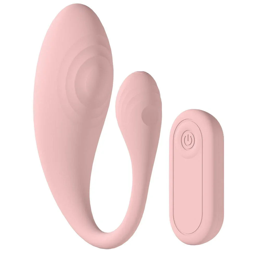 Loveline Wave C-Shaped Vibrator in Pink, the vibe laid out flat with the remote alongside