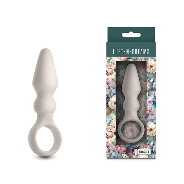 Lust-n-Dreams Bossa vibrating butt plug in Fog White, ring pull, beside its floral box