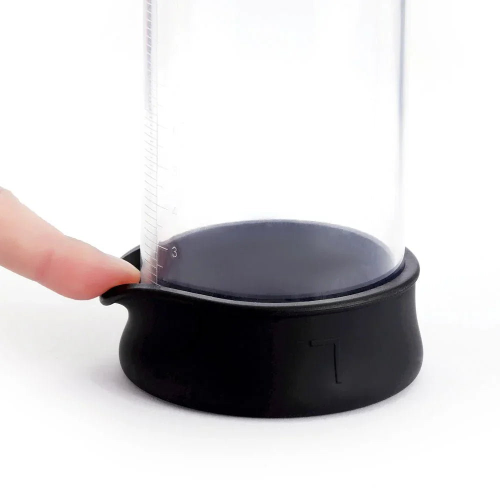Smart Penis Pump base close-up, finger pressing the silicone seal