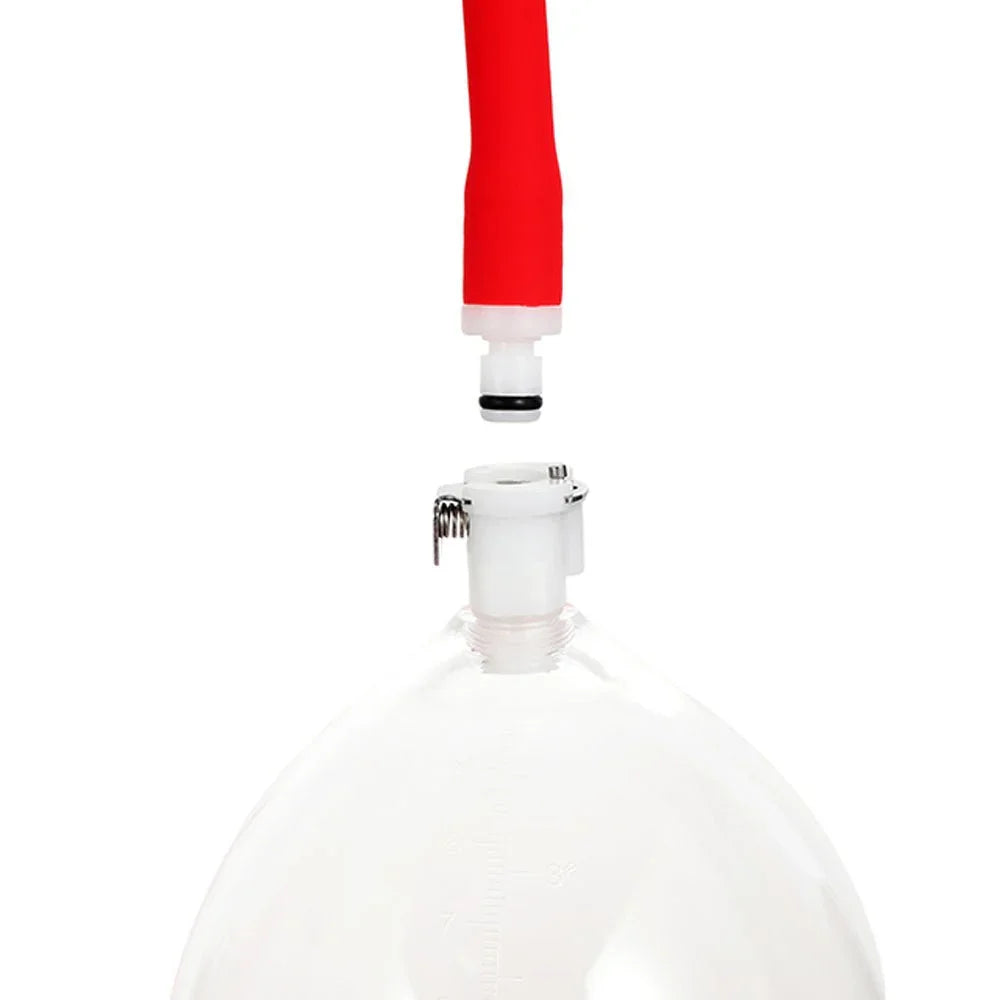 Vagina pump hose connector aligned over the cup valve, close-up