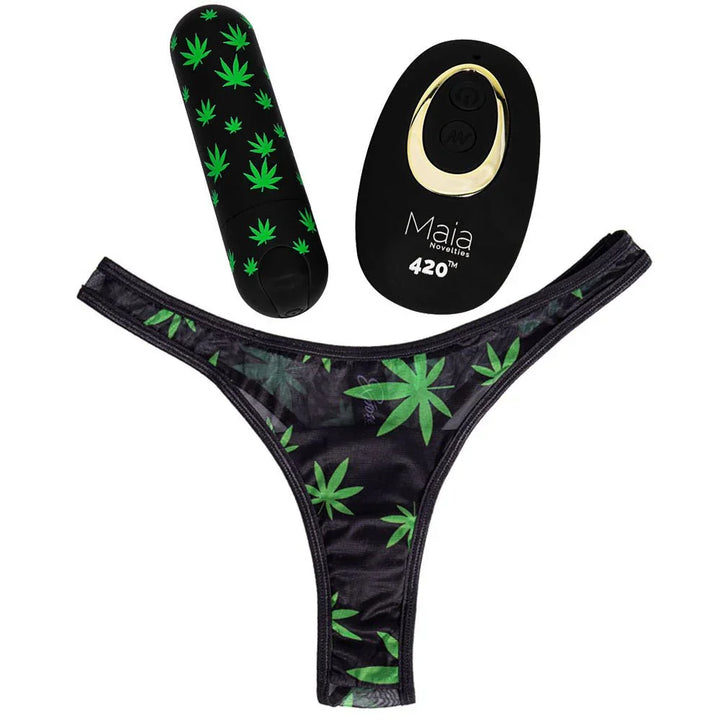 Maia Date Night 420 S/M leaf-print thong laid flat, bullet and remote above it