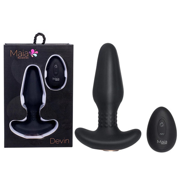 Maia Devin rotating butt plug in Black with its round remote, beside the Devin box
