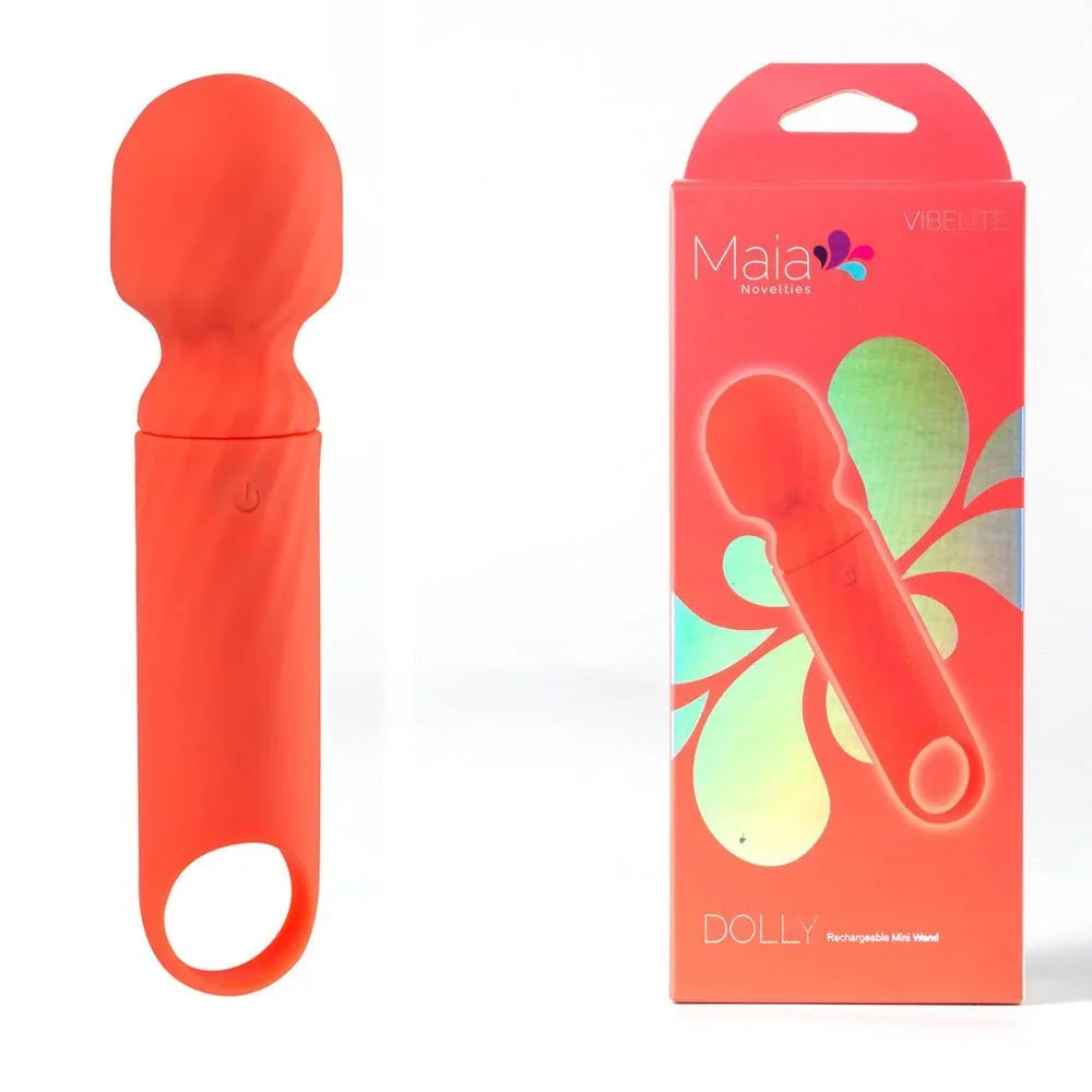 Maia Dolly mini wand in Orange with a looped handle, beside its orange Maia box