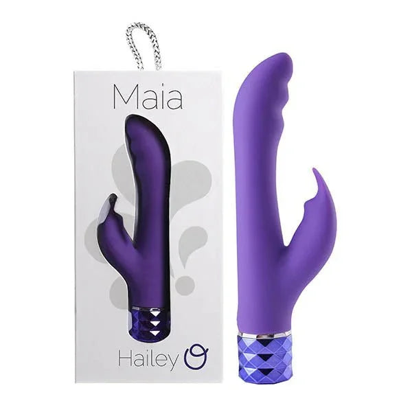 Maia Hailey rabbit vibrator in Purple with a faceted base, beside its Maia box
