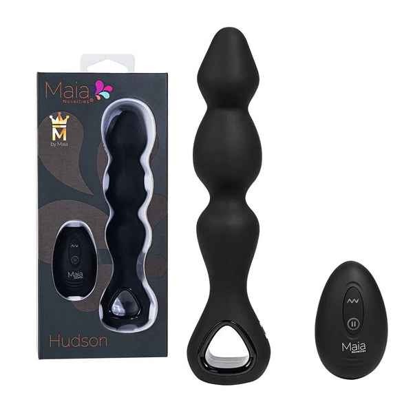 Maia Hudson anal vibrator in Black with its remote, beside the Hudson box
