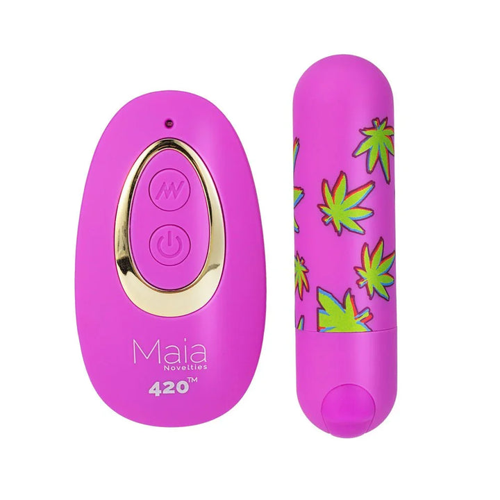 Maia Jessi 420 bullet in orchid purple beside its magenta and gold wireless remote