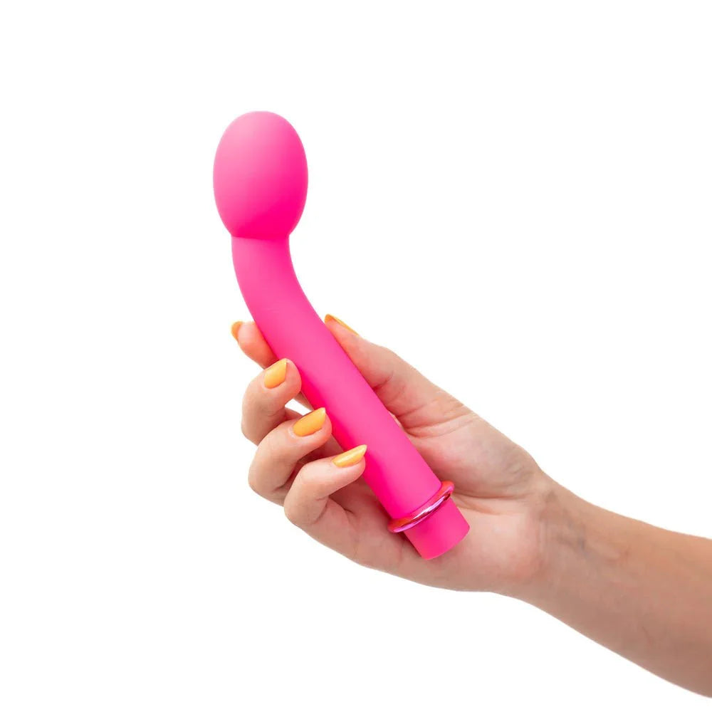 Maia Kora G-spot vibrator in Pink held in a hand, showing its scale