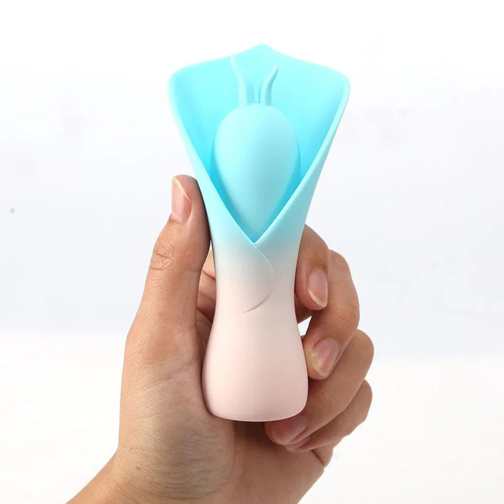 Maia Mina flower stimulator in Blue held in a hand, showing the soft petal cup