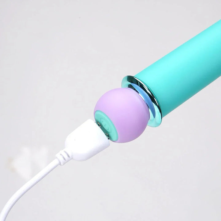 Maia Rori bullet base close-up, USB cable attached to the lilac charging cap
