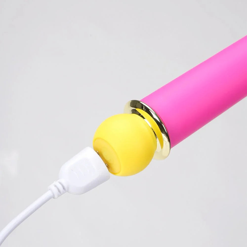 Maia Rori bullet base close-up, USB cable attached to the yellow charging cap