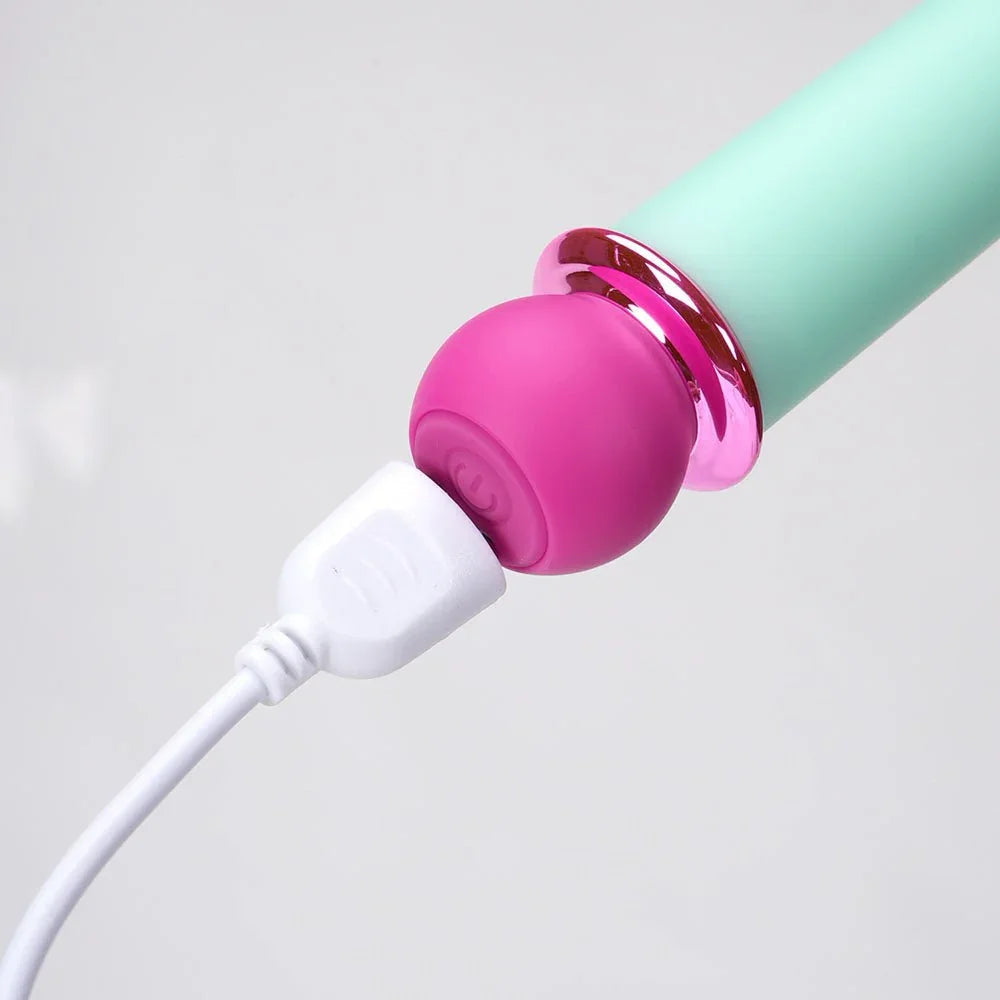 Maia Rori bullet base close-up, USB cable attached to the magenta charging cap