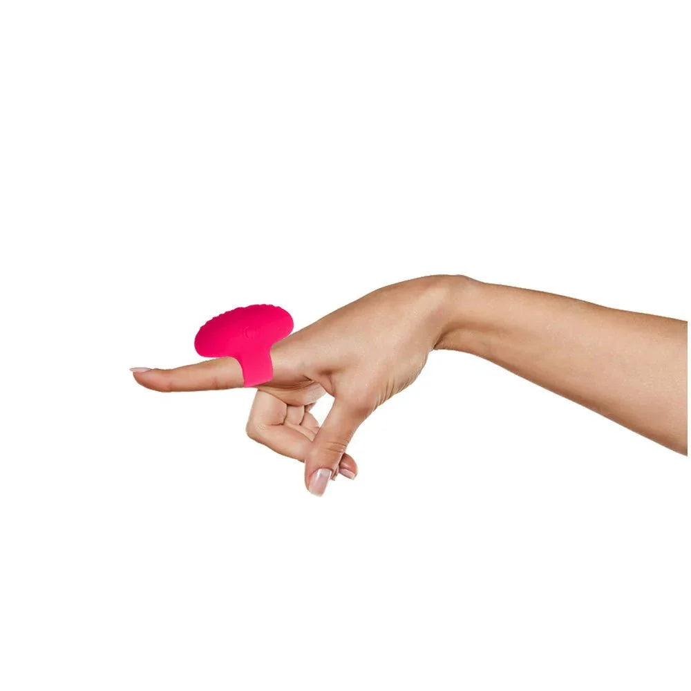 Maia Ruby finger stimulator in Pink worn on an index finger, hand pointing