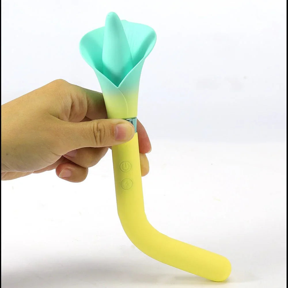 Maia Vala flower vibrator in Yellow held in a hand, the flexible stem bending