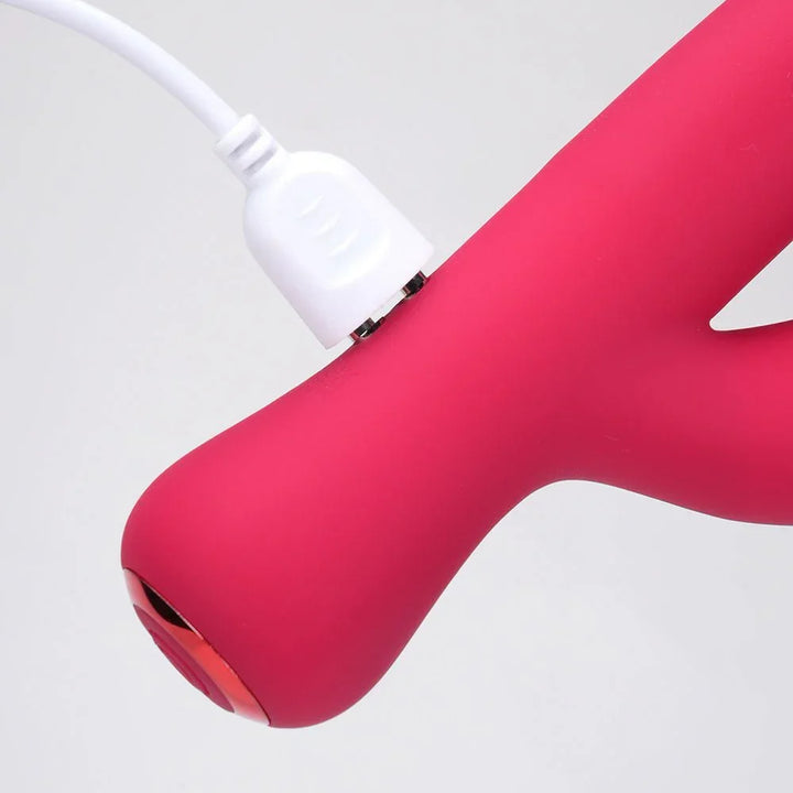 Maia Zara vibrator in Red, close-up of the base with the charging cable attached
