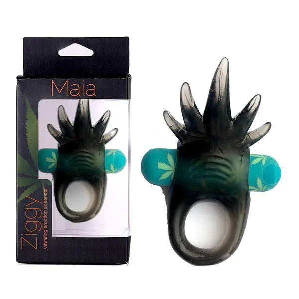 Maia Ziggy vibrating cock ring in Hemp Green with a clawed pad, beside its Maia box