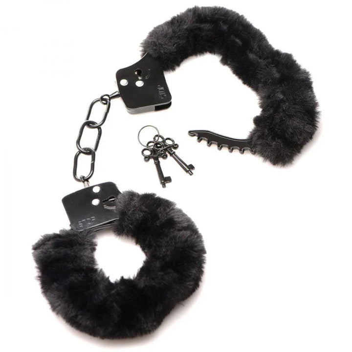 Black furry handcuffs flat on white with the keys and the black release pick beside them