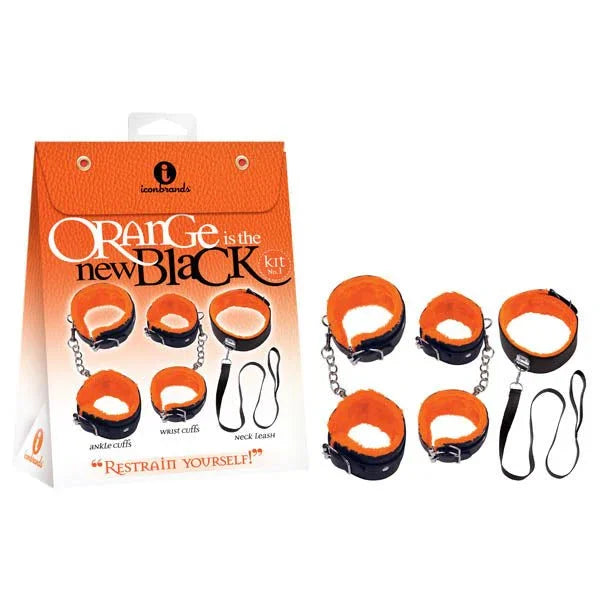 Orange Is The New Black Restrain Yourself kit box beside orange-lined cuffs and neck tease