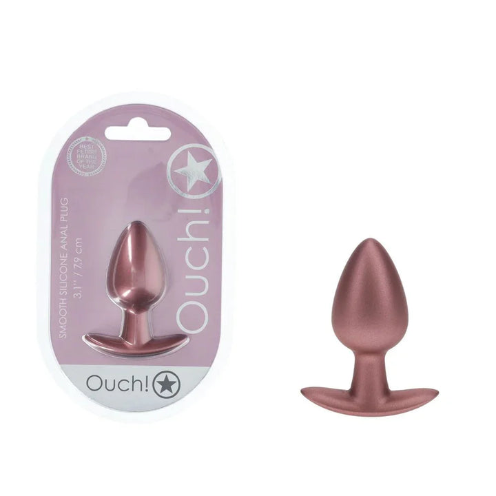 OUCH! Medium Metal Anal Plug in Rose Gold, blister pack beside the tapered plug with flared base