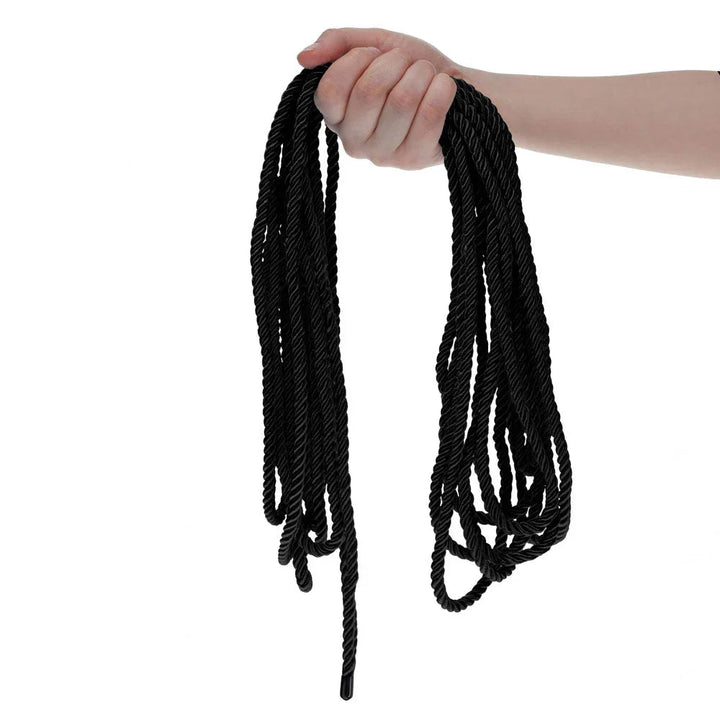 OUCH! Nylon Bondage Rope 10m in Black, held up so the full loops hang free against white
