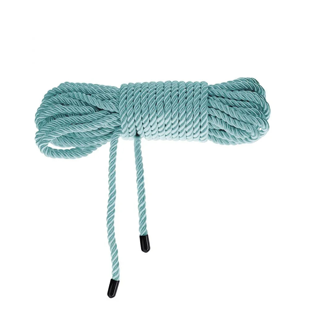 OUCH! Nylon Bondage Rope 10m in Blue, coiled bundle on white showing the black whipped ends