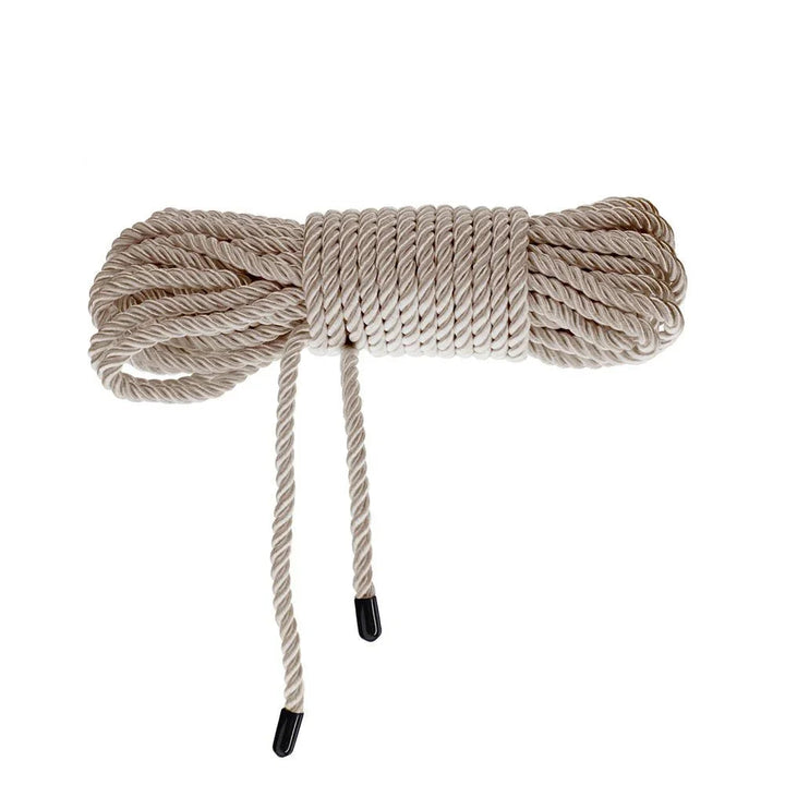 OUCH! Nylon Bondage Rope 10m in Gold, coiled bundle on white showing the black whipped ends