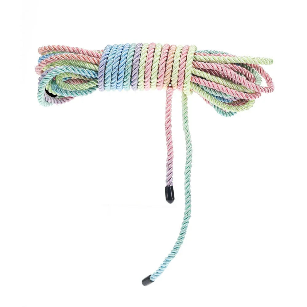 OUCH! Nylon Bondage Rope 10m in Multicolour, coiled bundle on white showing the black whipped ends