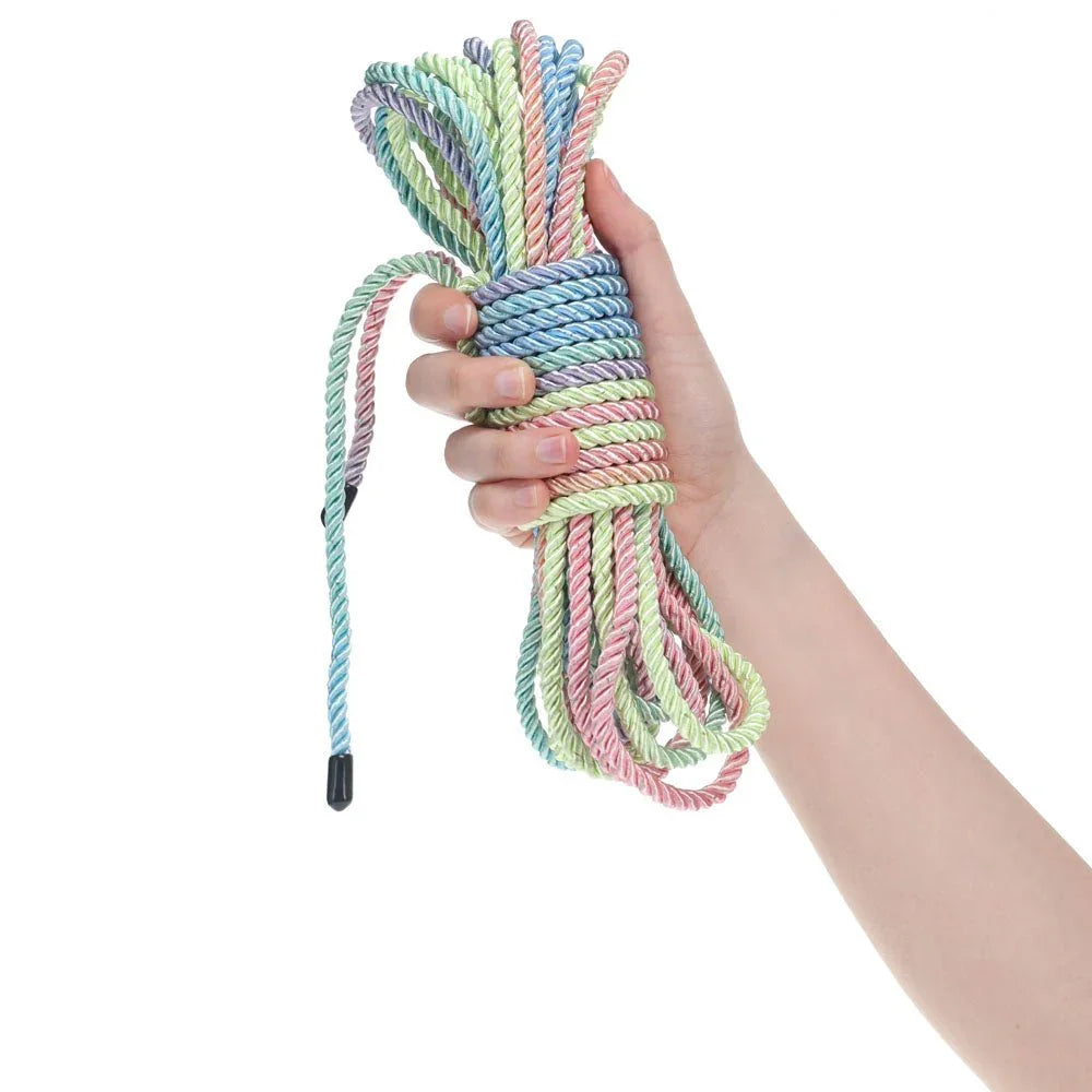 OUCH! Nylon Bondage Rope 10m in Multicolour, the coiled pastel hank held in one hand