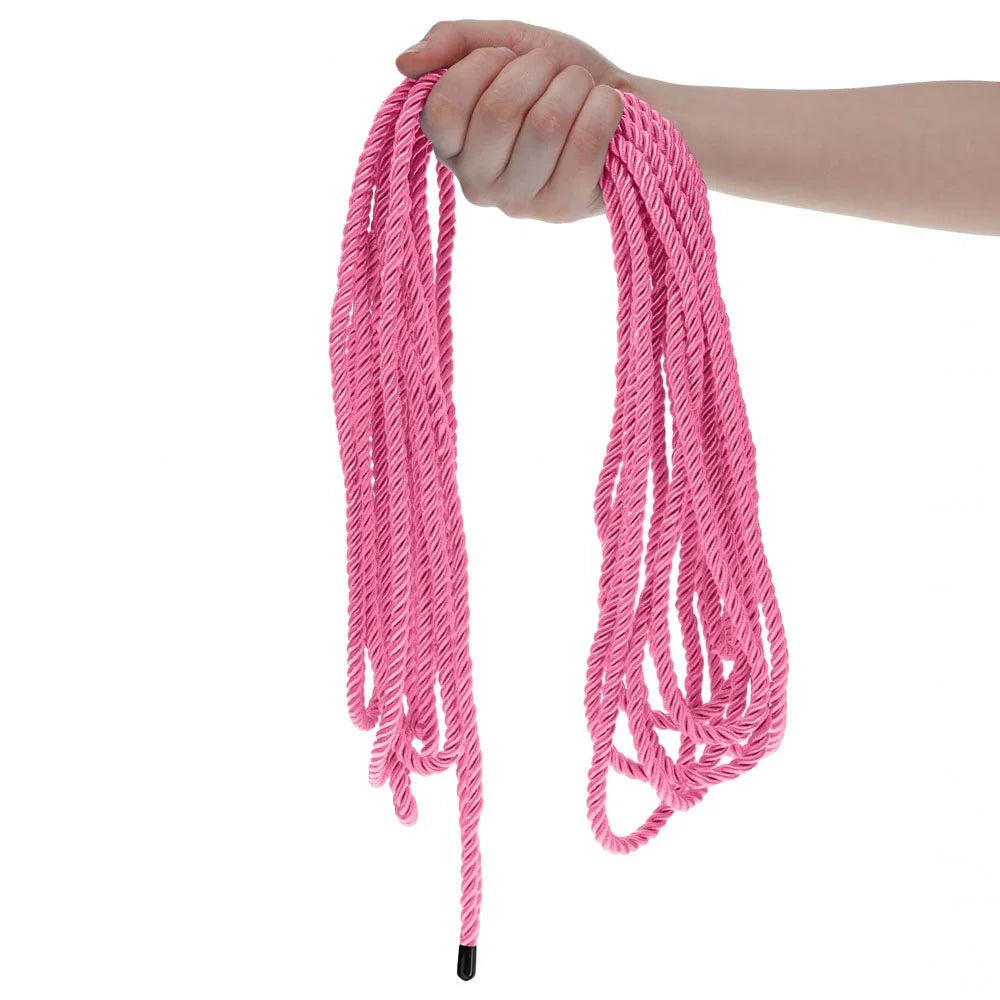 OUCH! Nylon Bondage Rope 10m in Pink, held up with the pink loops hanging free against white