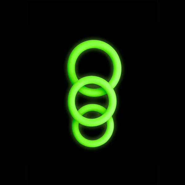 OUCH! Glow in the Dark Cock Ring Set of 3 in Green, the three rings glowing against a black background