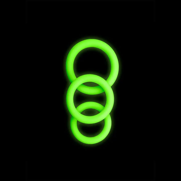 OUCH! Glow in the Dark Cock Ring Set of 3 in Green, the three rings glowing against a black background