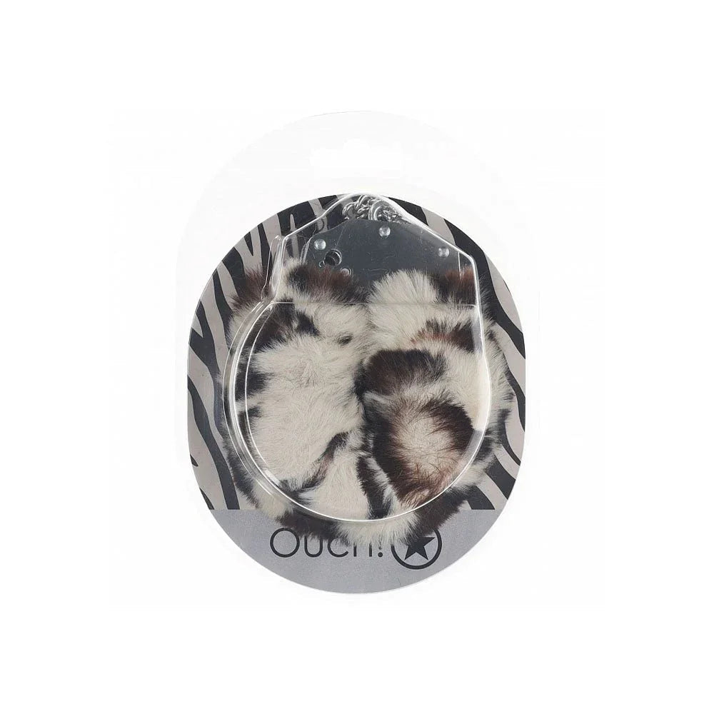 OUCH! Heavy-Duty Fluffy Handcuffs in Snow Leopard, spotted cuffs sealed on a zebra-print card