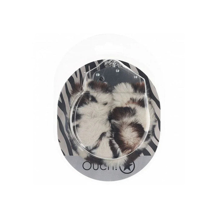 OUCH! Heavy-Duty Fluffy Handcuffs in Snow Leopard, spotted cuffs sealed on a zebra-print card