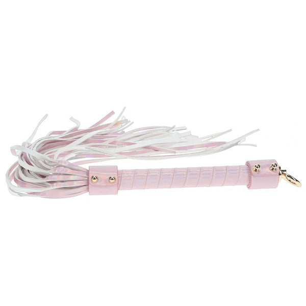 OUCH! Paris Flogger Whip in Pink, iridescent pink flogger laid flat with its falls fanned out