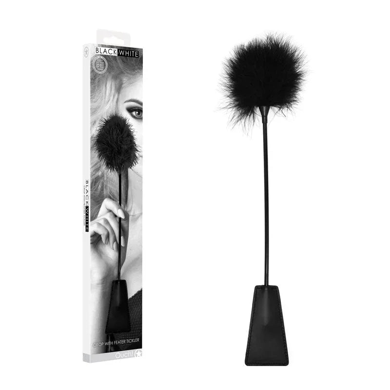 OUCH! Black & White Crop with Feather Tickler in Black, retail box beside the crop with its feather tip
