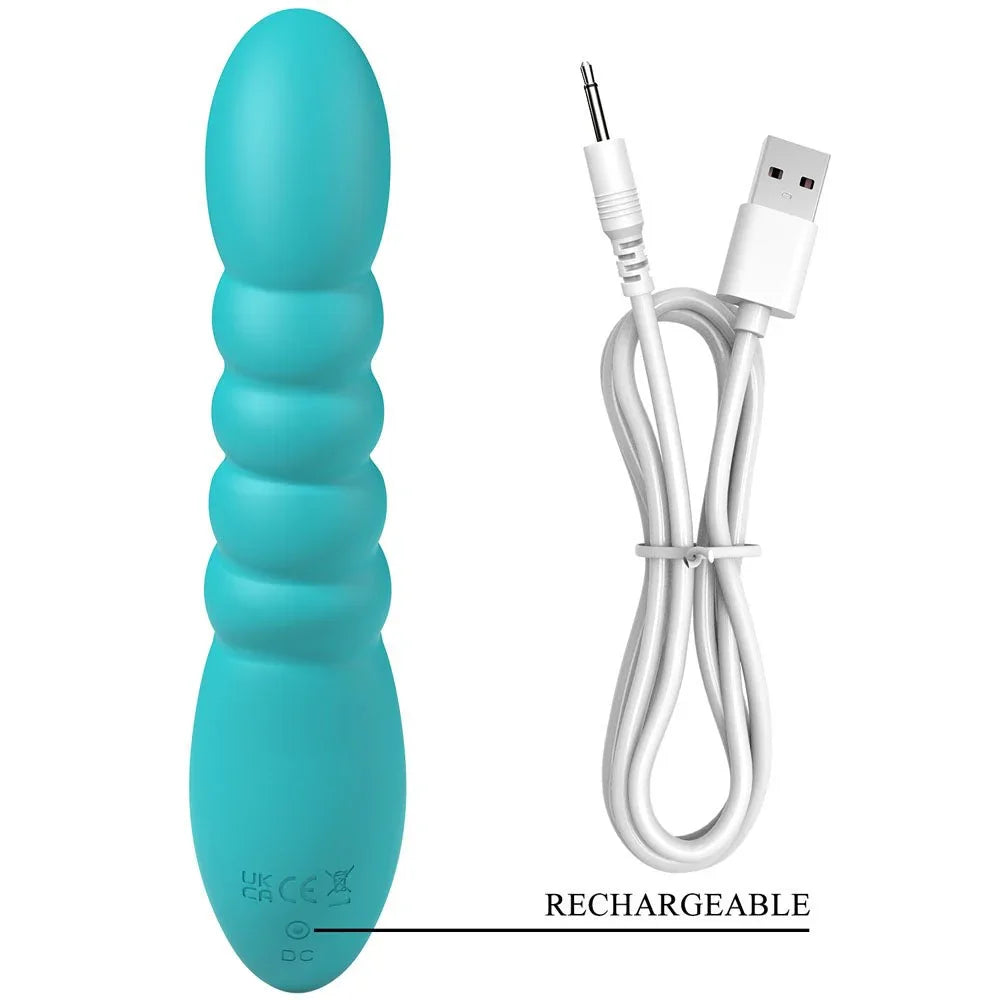 Party Up Brynlyn in Teal beside its white USB charging cable, magnetic contacts shown