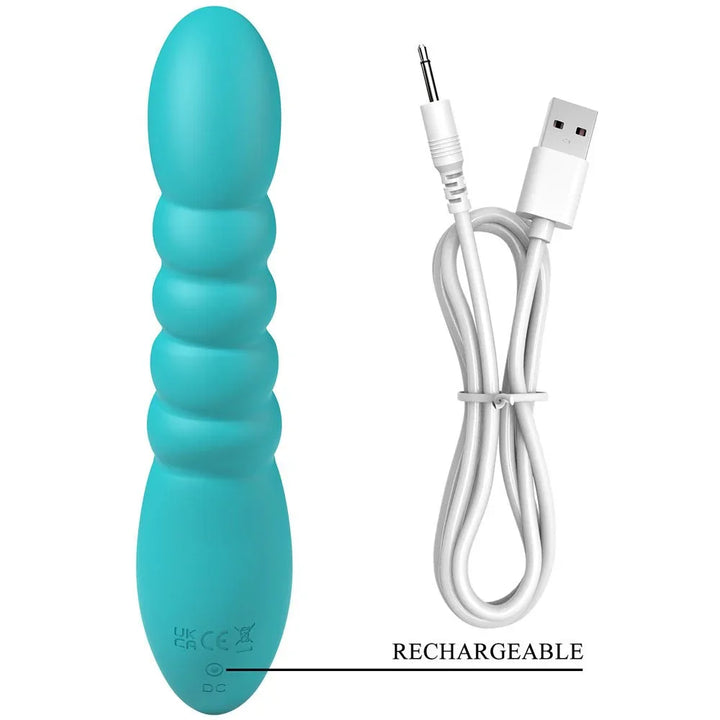 Party Up Brynlyn in Teal beside its white USB charging cable, magnetic contacts shown
