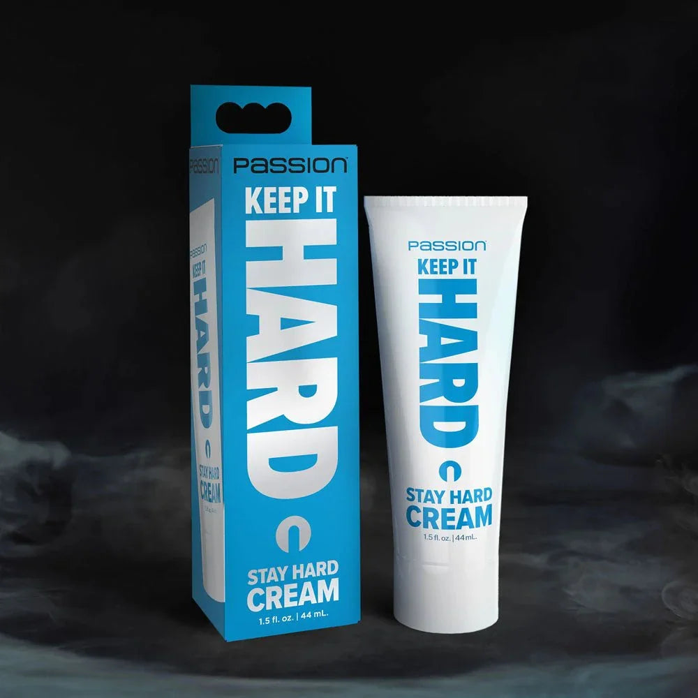 Passion Keep It Hard stay hard cream, white tube beside its blue carton on a dark backdrop